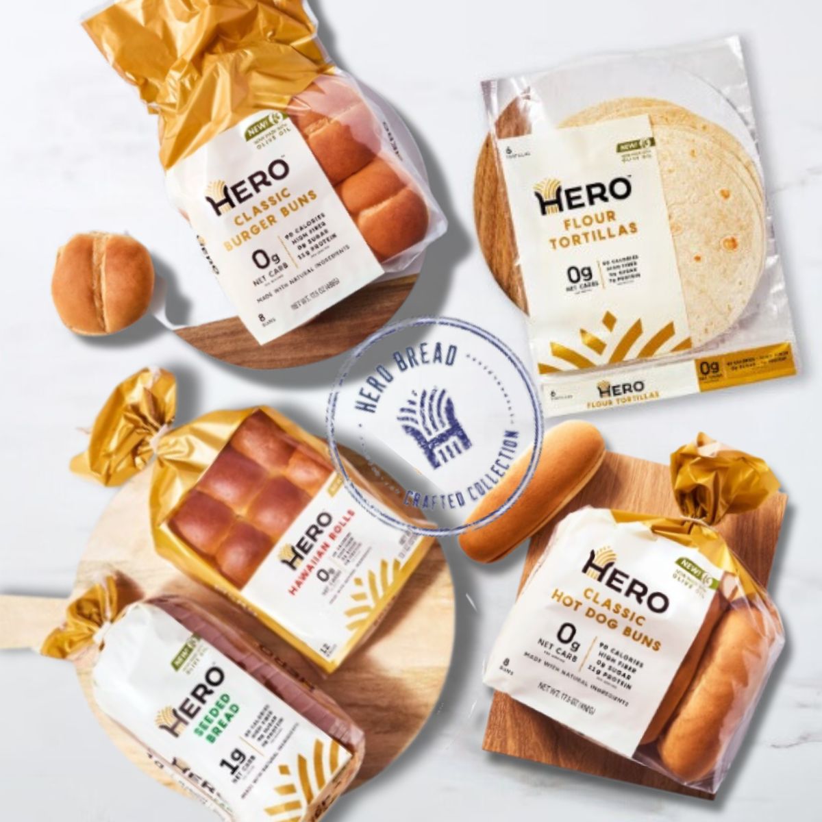 Four packages of Hero brand zero-net-carb bread products, including burger buns, hot dog buns, and flour tortillas, are displayed on a wooden surface with a logo in the center.