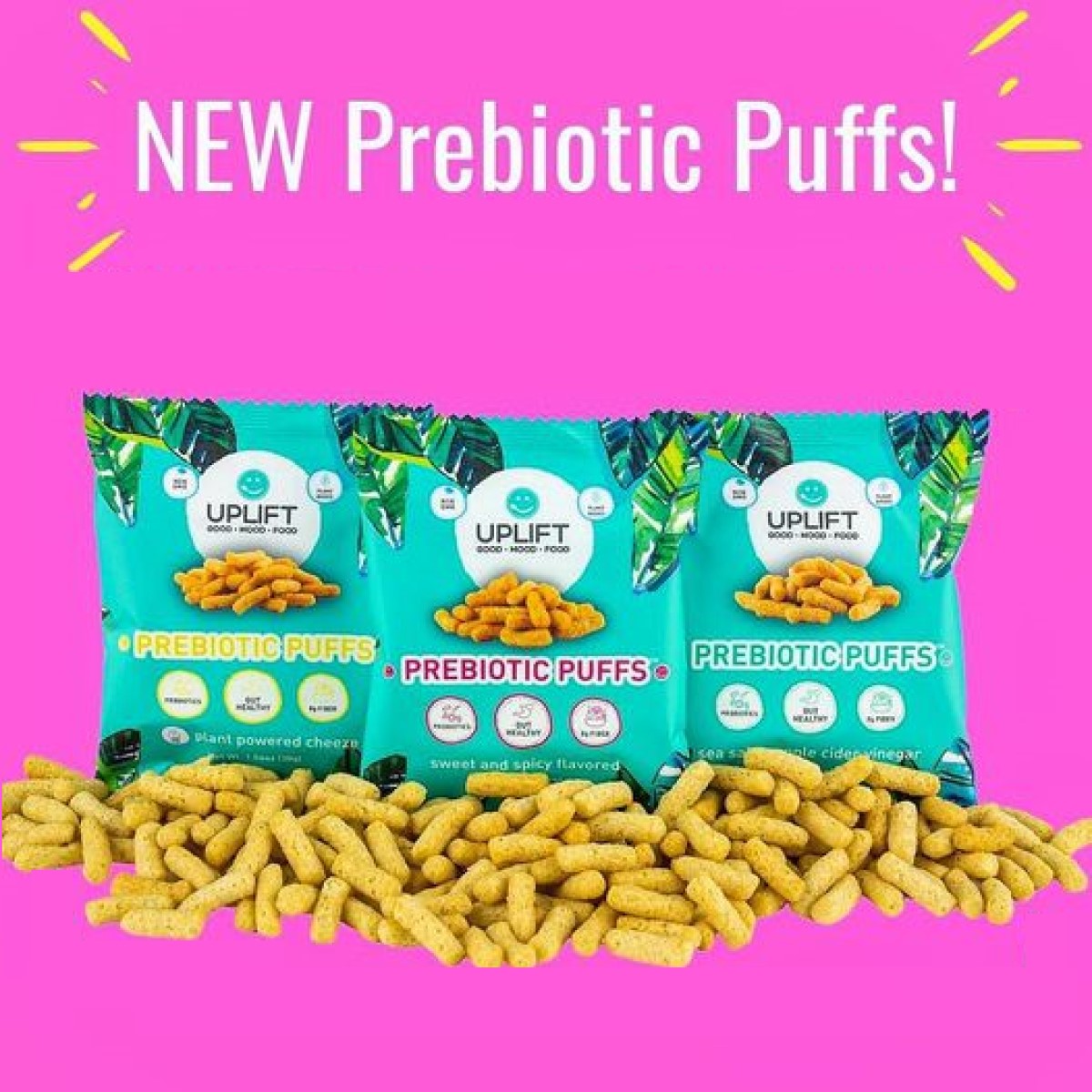 Three colorful bags of Uplift Foods' Prebiotic Puffs are displayed against a bright pink background, with the puffs spilling out in front, highlighting their plant-powered and flavorful snack options.