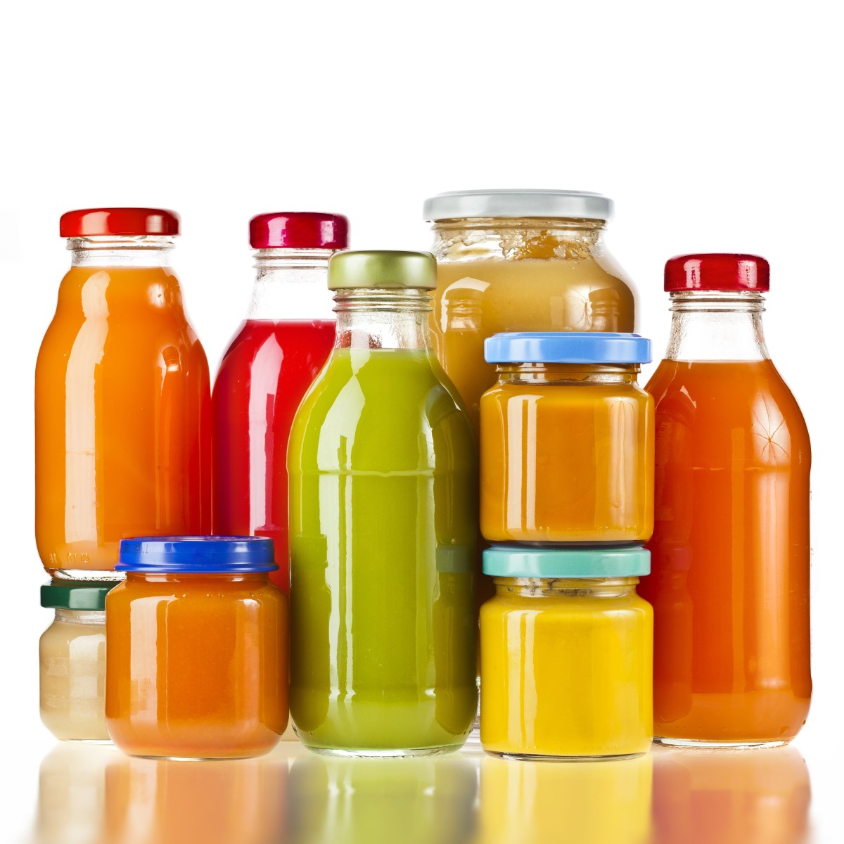 A variety of colorful bottles and jars filled with different juices and liquids are arranged closely together, showcasing options suitable for a bariatric post-surgery liquid diet.