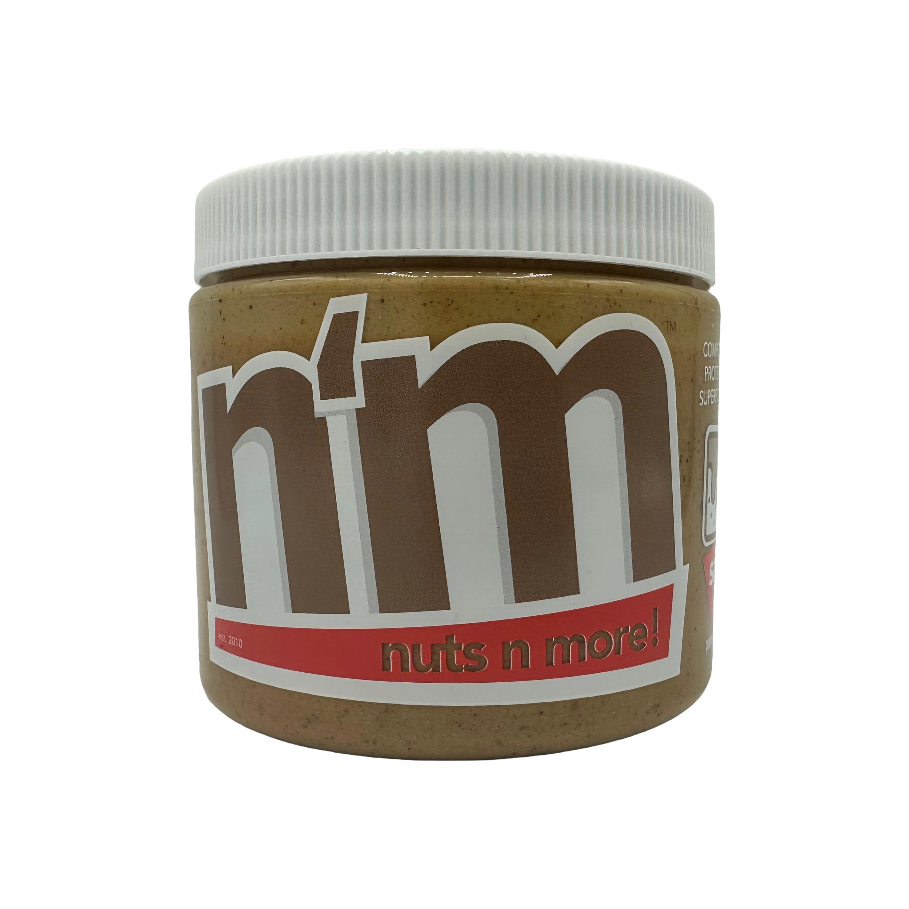 A jar of "Nuts N More" nut butter is shown, featuring a light brown color and a white lid, with bold lettering on the label highlighting its name and brand.