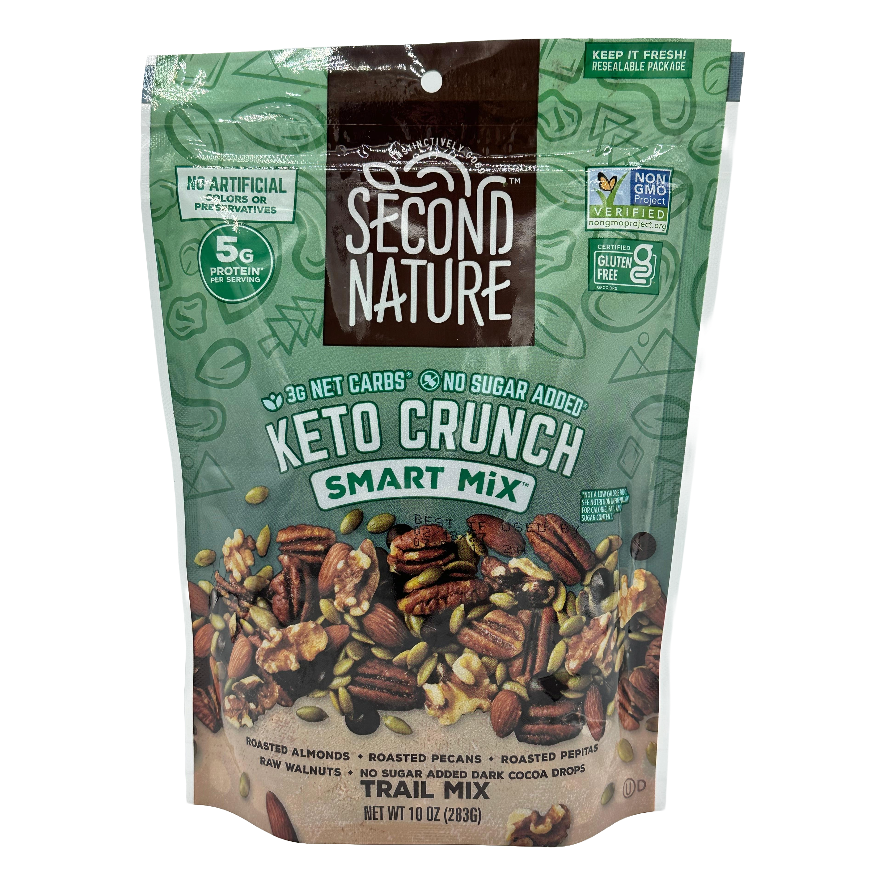 A resealable bag of Second Nature Keto Crunch Smart Mix, featuring a blend of roasted almonds, pecans, and pepitas, with labels highlighting low net carbs and no added sugar.
