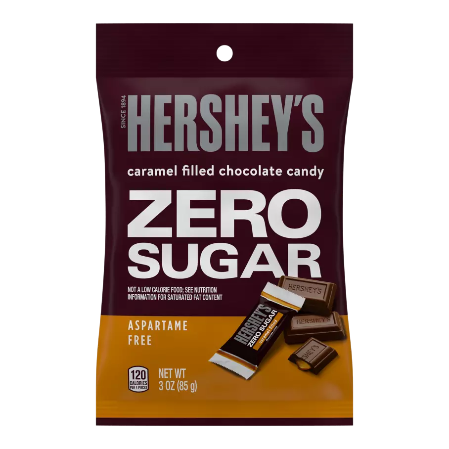 A bag of Hershey's Zero Sugar caramel-filled chocolate candy, featuring bold text highlighting "ZERO SUGAR," with a display of individual candy pieces in front, set against a dark background.