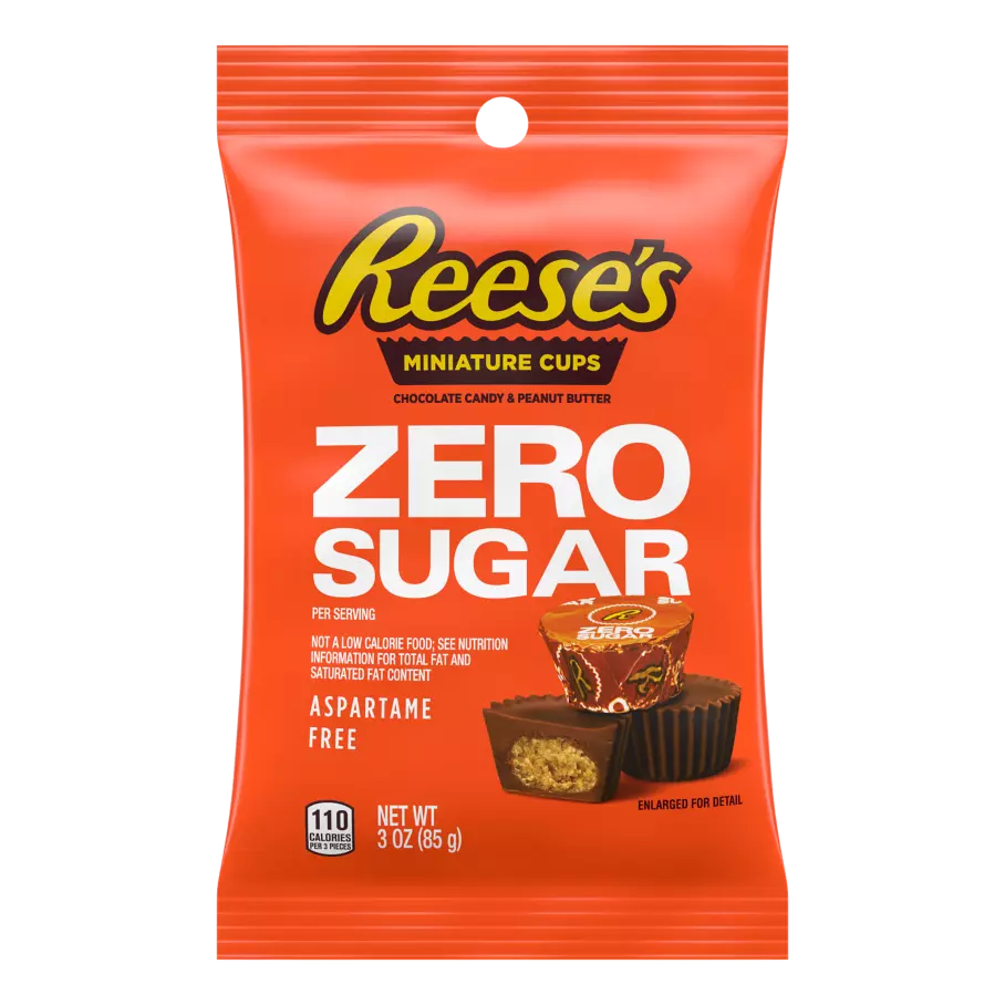 A bright orange package of Reese's Miniature Cups features the text "ZERO SUGAR," highlighting the chocolate candy and peanut butter treats that are aspartame-free and weigh 3 oz.