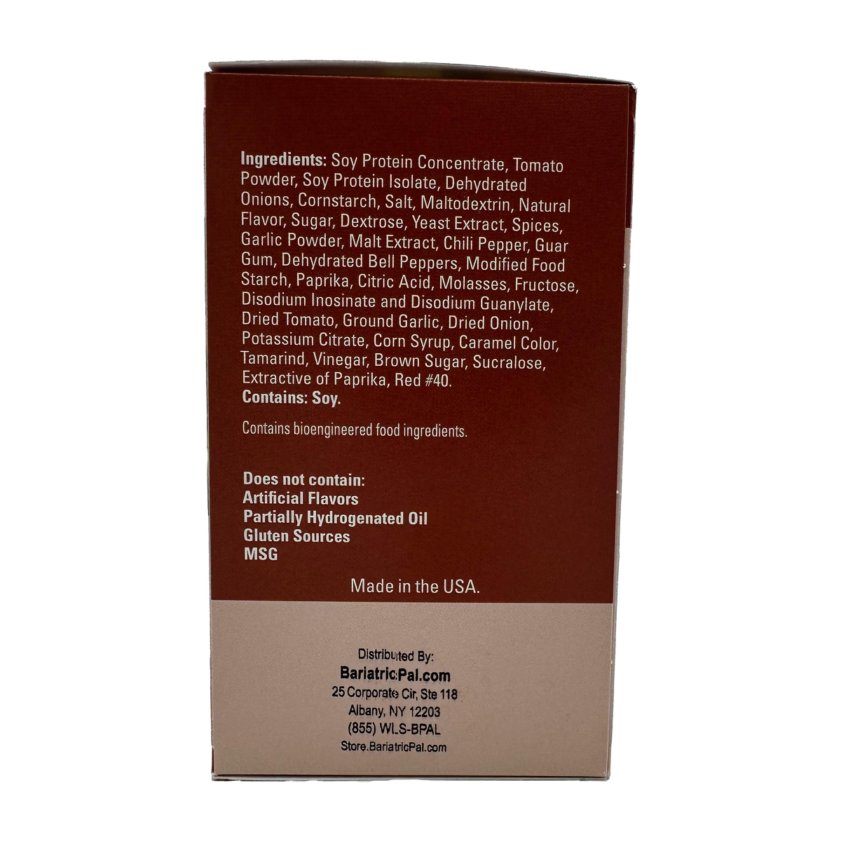 A brown packaging box displays a list of ingredients and dietary information for a food product, highlighting that it contains soy and does not include artificial flavors or gluten.