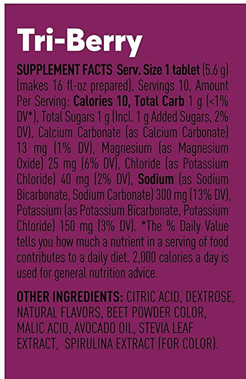 A purple supplement label for "Tri-Berry" details nutritional facts, including serving size, calories, and ingredients like citric acid and natural flavors.