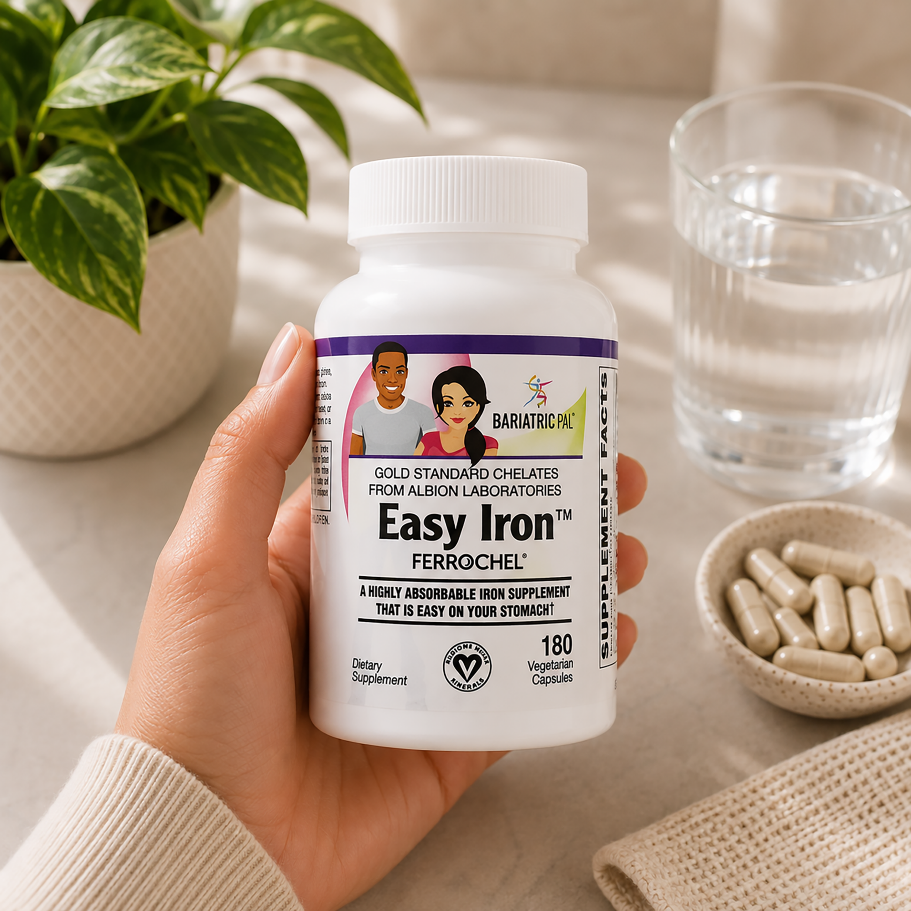 Hand holding bottle of BariatricPal Easy Iron with Ferrochel supports healthy iron levels, red blood cell production, energy and vitality while remaining gentle on the stomach. Vegetarian, non-GMO and gluten-free; 180 capsules.
