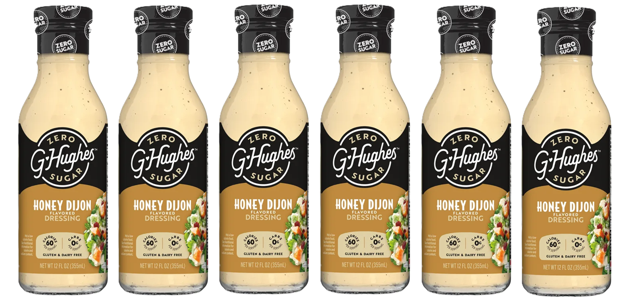 Six bottles of G Hughes Honey Dijon flavored dressing are lined up, each labeled with "Zero Sugar" and details about being gluten and dairy-free, showcasing a light-colored dressing inside.