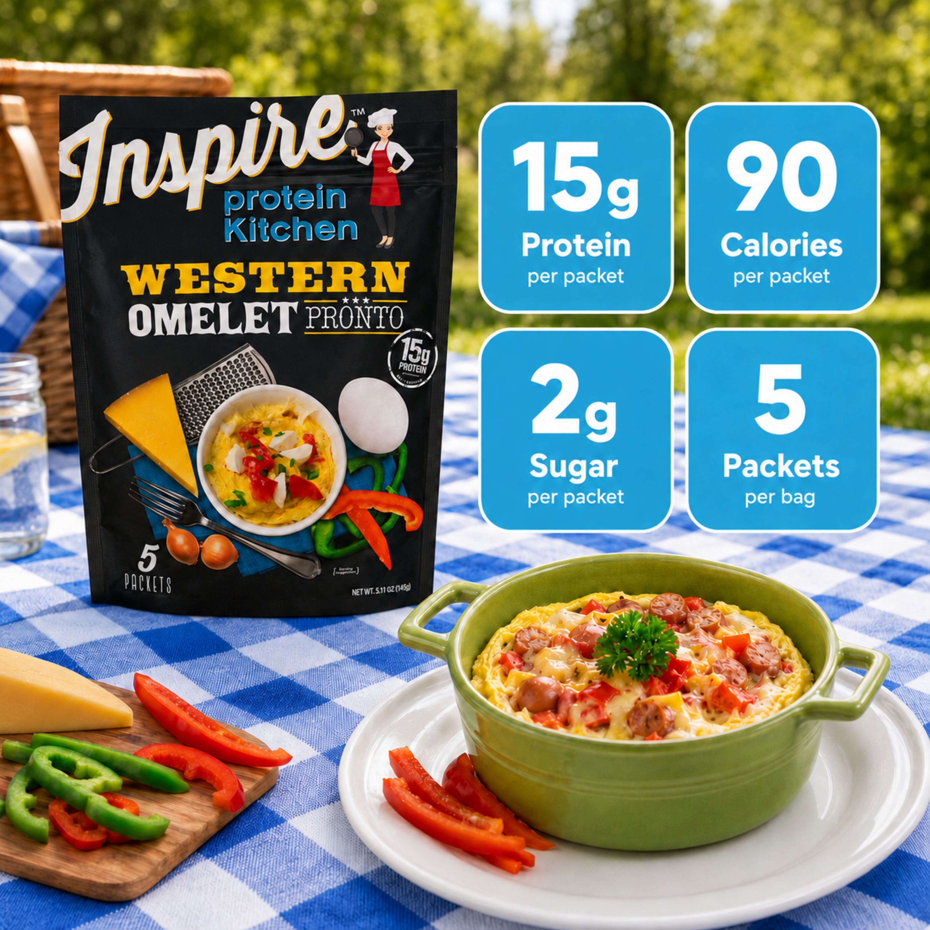 A green bowl filled with a Western omelet topped with vegetables sits on a table with a blue checkered tablecloth, next to a package of Inspire Protein Kitchen's Western Omelet Pronto, highlighting nutrition facts.