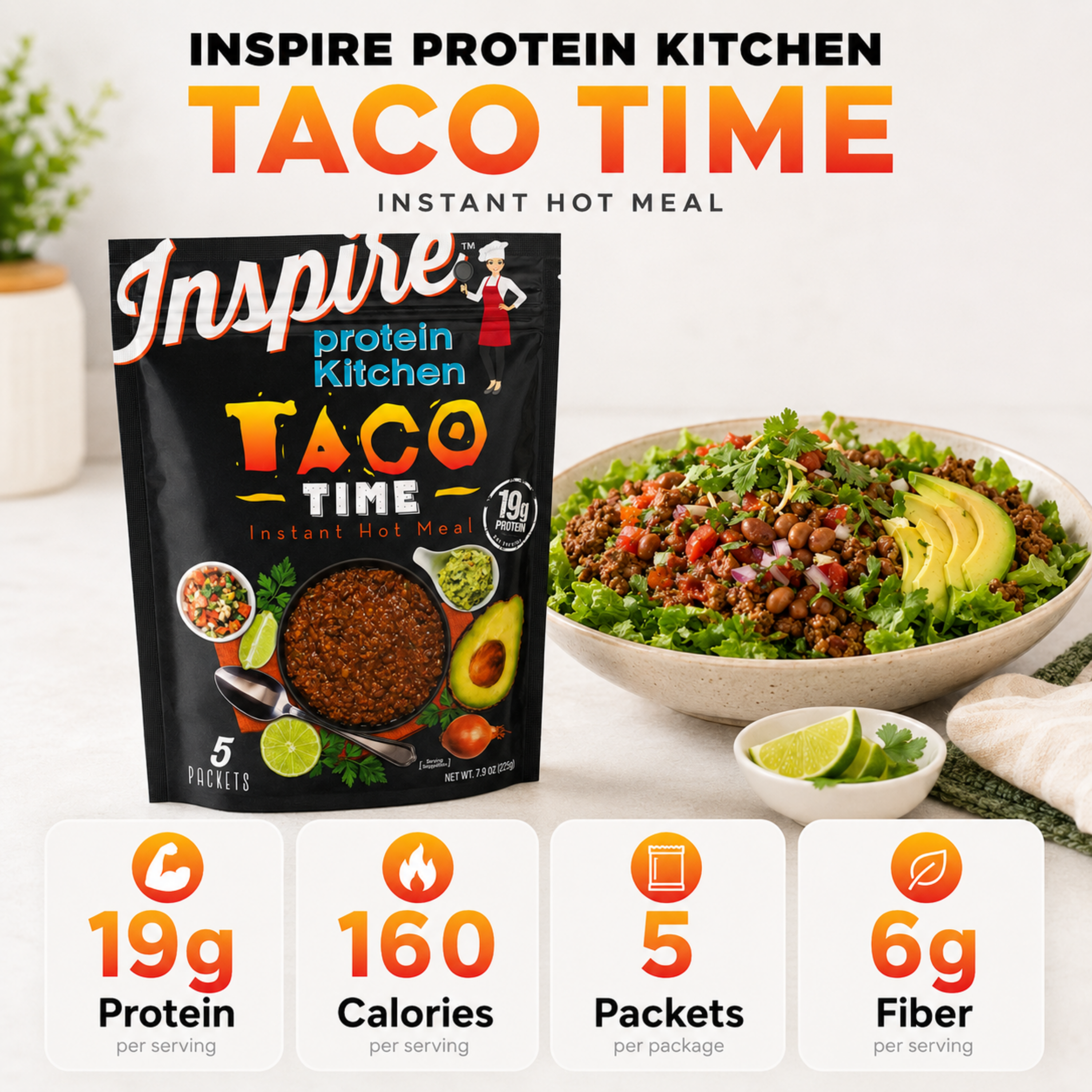 Package of Inspire Protein Kitchen Taco Time Instant Hot Meal displayed beside a bowl of taco filling topped with avocado and greens, with a small bowl of lime wedges nearby.