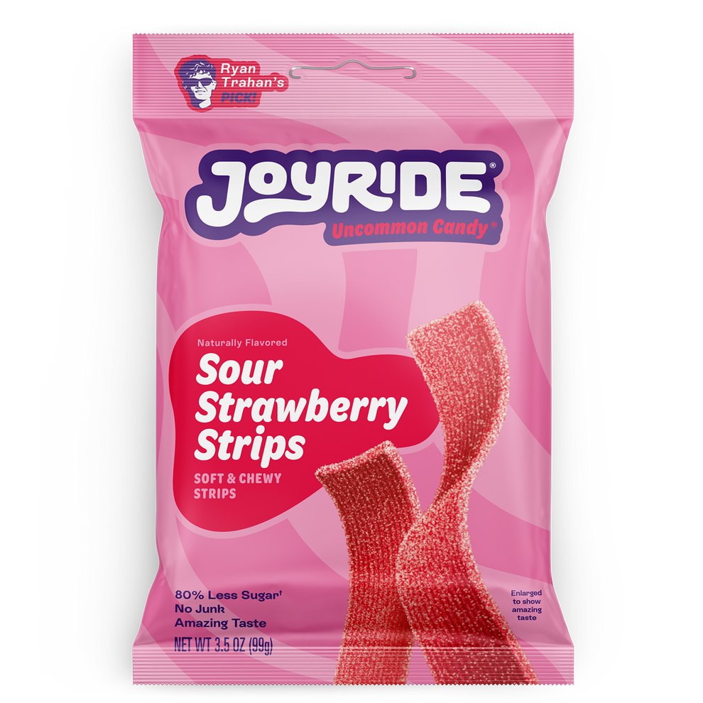 A pink package of Joyride Sour Strawberry Strips features the product name prominently, with images of the chewy candy strips, highlighting they are naturally flavored and have 80% less sugar.