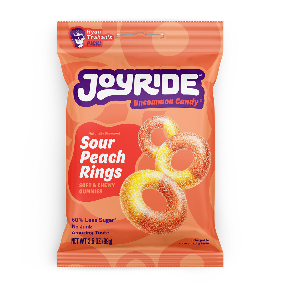 A colorful package of Joyride Sour Peach Rings features soft, chewy gummy candies shaped like rings, highlighted by text indicating they have 50% less sugar and are naturally flavored.