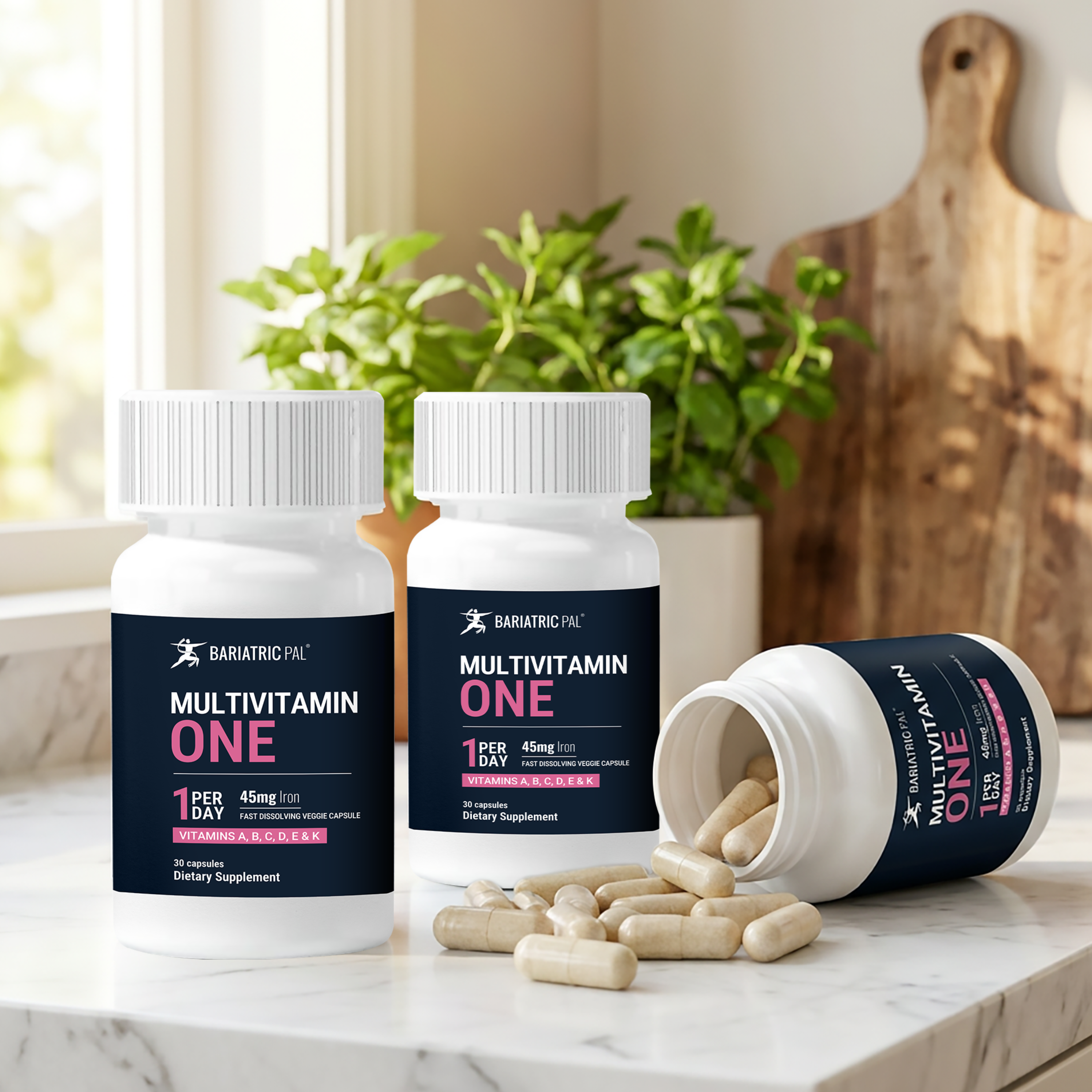 Three bottles of BariatricPal Multivitamin ONE with one tipped on it's side spilling capsules out on the table.