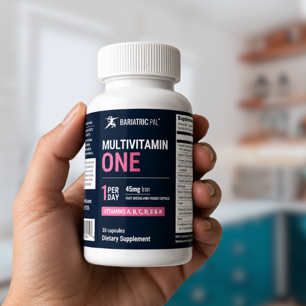 Hand holding a BariatricPal Multivitamin ONE.