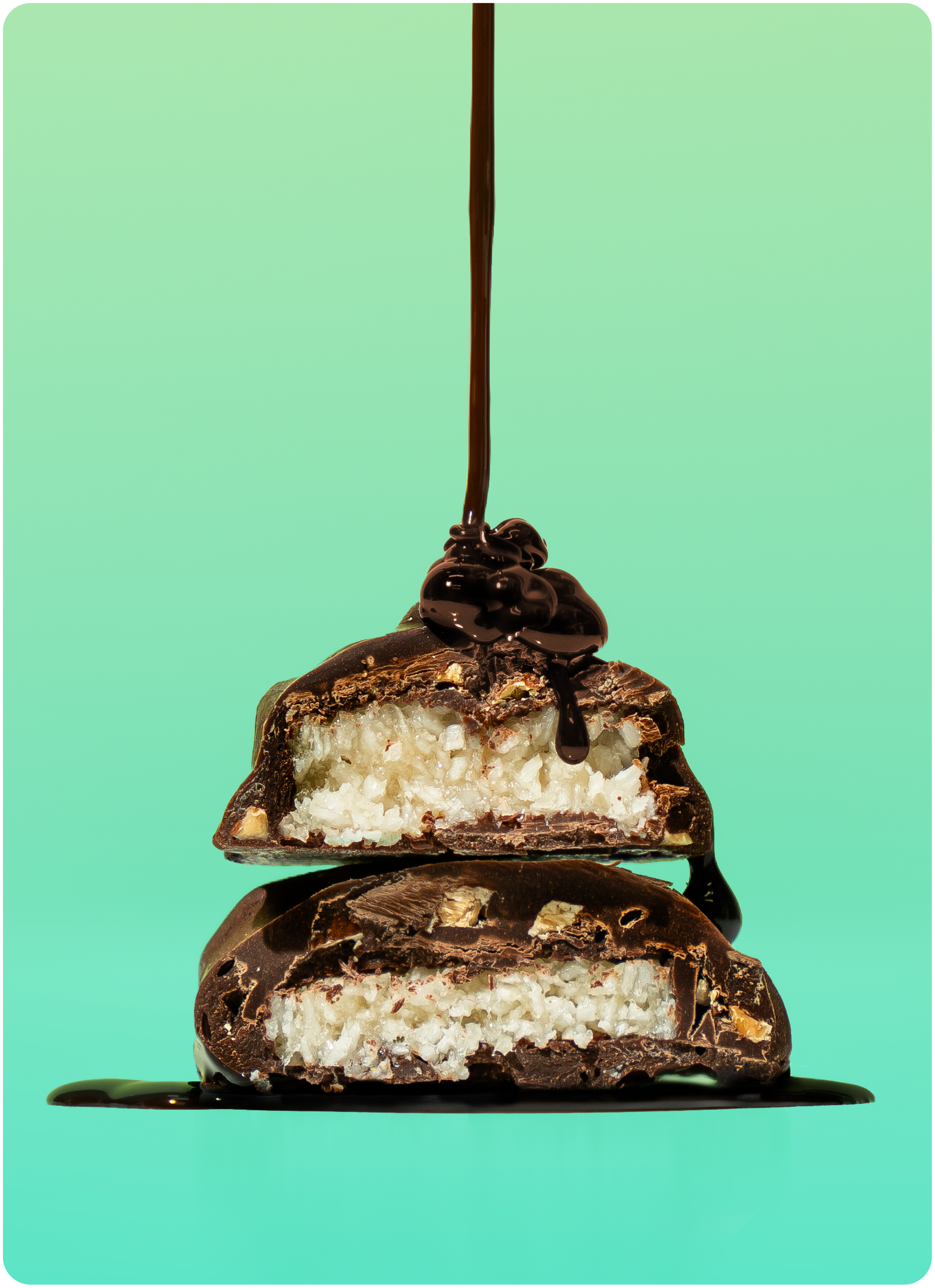 Chocolate-covered coconut candy with a glossy chocolate drizzle, showcasing a layered interior of shredded coconut and chocolate, set against a gradient green background.