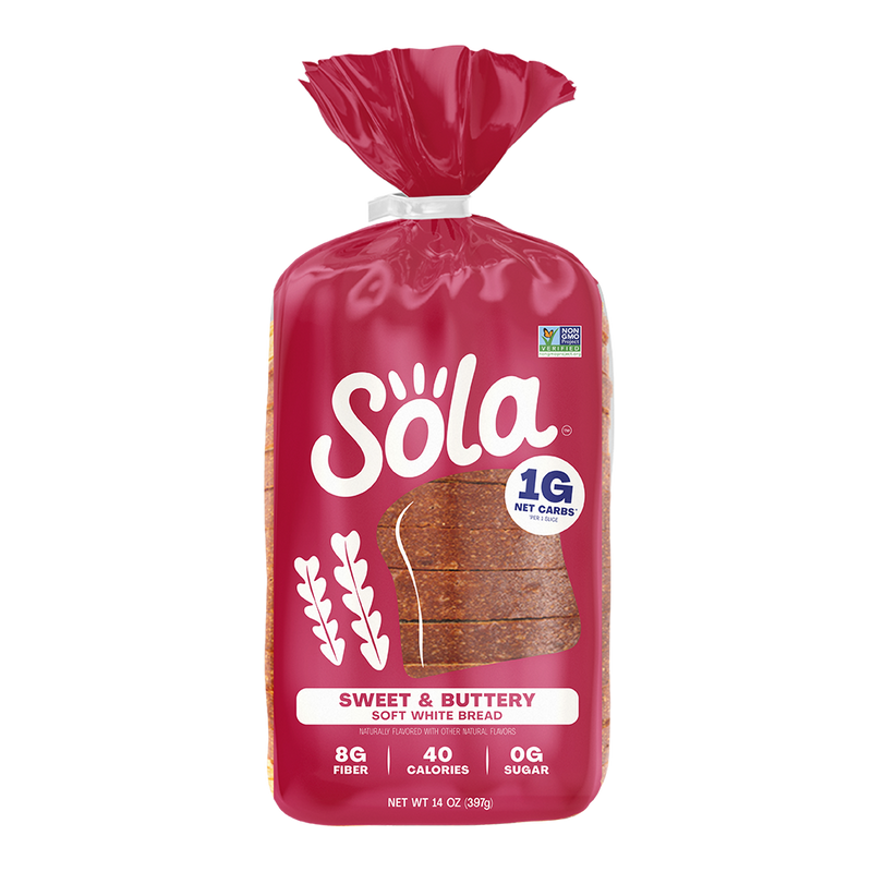 A red package of Sola Sweet & Buttery soft white bread displays sliced bread on the front, highlighting its low-calorie content with 1 gram of net carbs, 8 grams of fiber, and 0 grams of sugar.