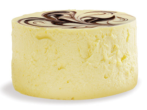 A round, creamy yellow cheese with a decorative dark chocolate swirl on top, displayed against a plain white background, highlighting its smooth texture and appealing design.