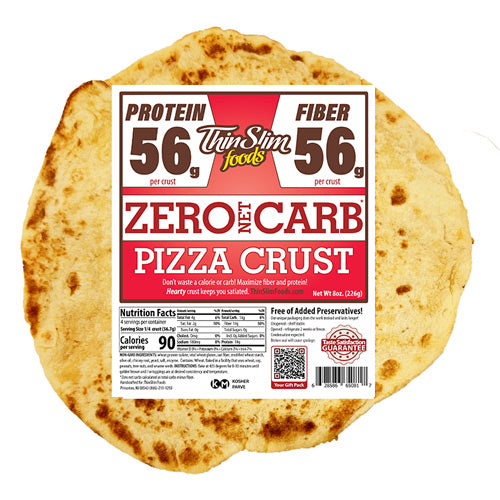 A round, thin pizza crust with a nutrition label prominently displaying "Zero Net Carb" and high protein and fiber content, set against a white background.