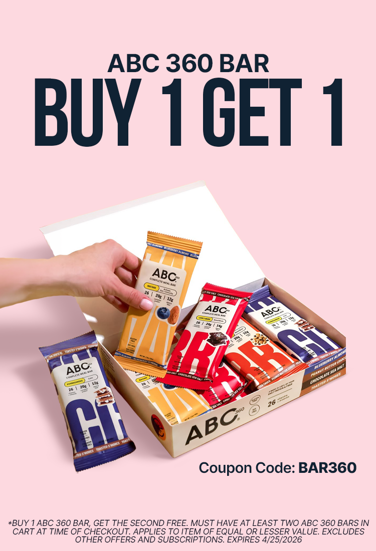 A hand reaches for an ABC 360 bar from an open box displaying various flavors, with promotional text highlighting a "Buy 1 Get 1" offer and a coupon code on a pink background.