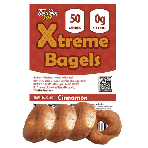 A package of Thin Slim Foods Xtreme Bagels in cinnamon flavor, featuring four bagels on the bottom, with nutritional information stating 50 calories and 0 grams of net carbs prominently displayed.
