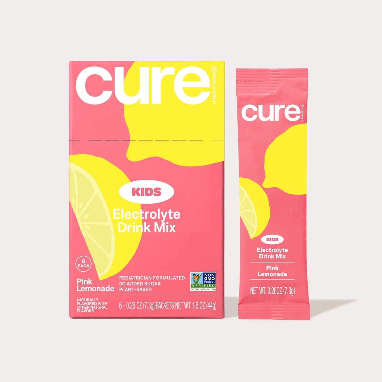 A bright pink box of Cure Kids Electrolyte Drink Mix, featuring yellow lemon graphics, displays six individual packets labeled "Pink Lemonade" for hydration without added sugar.