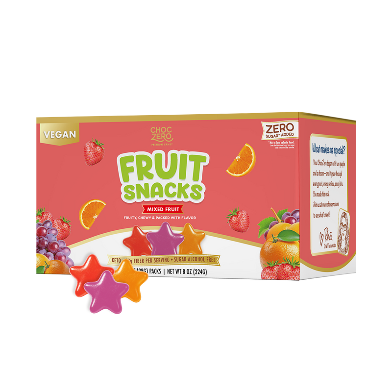 A colorful box of vegan mixed fruit snacks features a bright design with fruit illustrations and star-shaped gummies in various colors placed in front, highlighting its zero sugar and keto-friendly attributes.