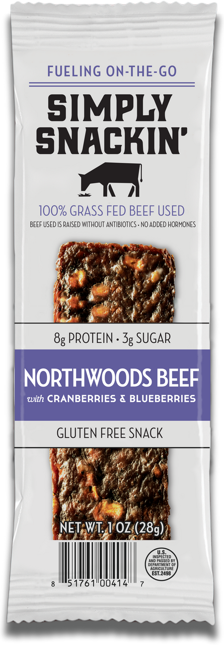 A packaged snack bar labeled "Simply Snackin' Northwoods Beef with Cranberries & Blueberries," highlighting gluten-free, 100% grass-fed beef, and nutritional information.
