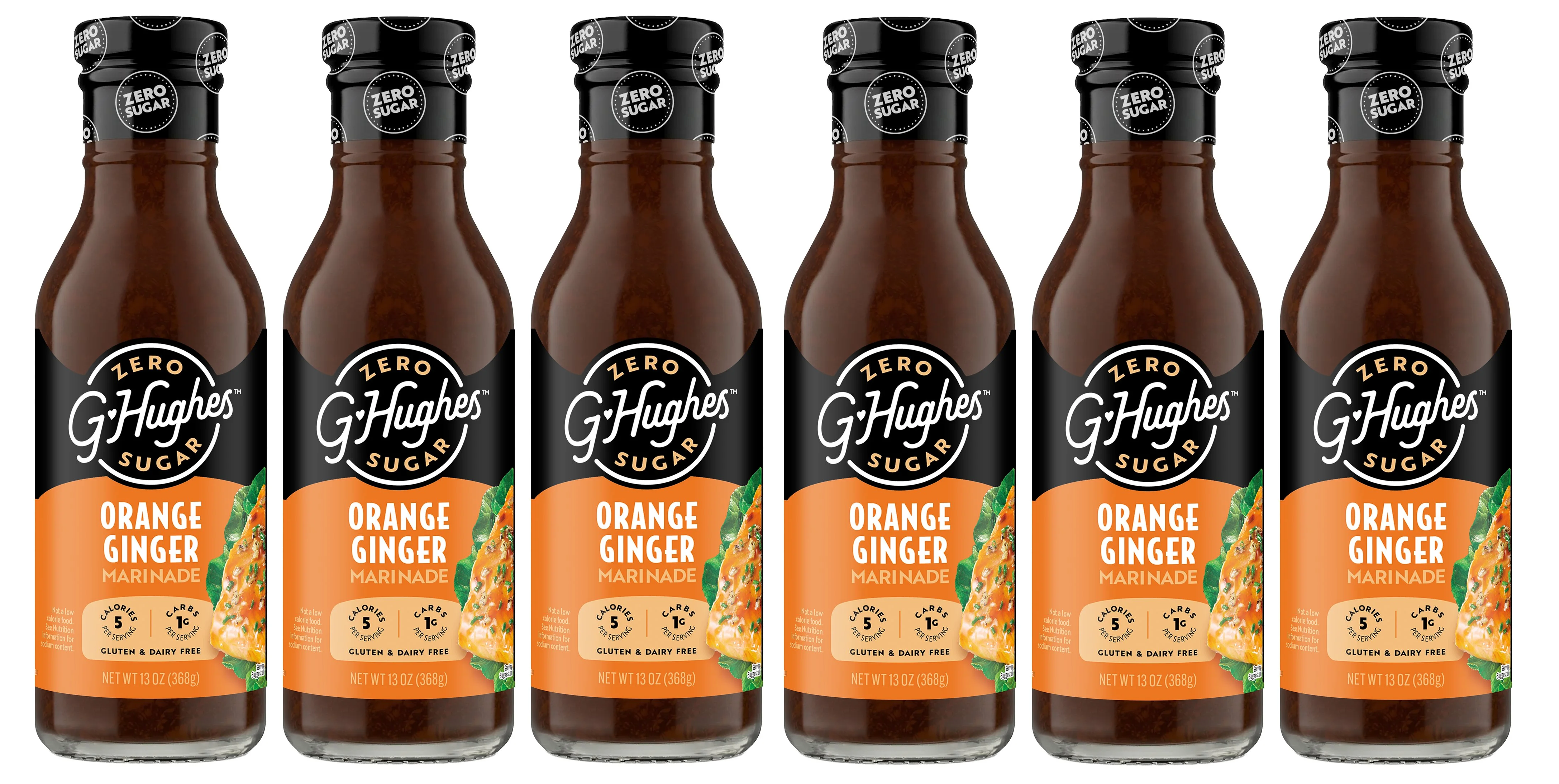 Six bottles of G Hughes Zero Sugar Orange Ginger Marinade are lined up, each labeled with nutritional information, highlighting that they are gluten and dairy-free, with a net weight of 13 ounces.