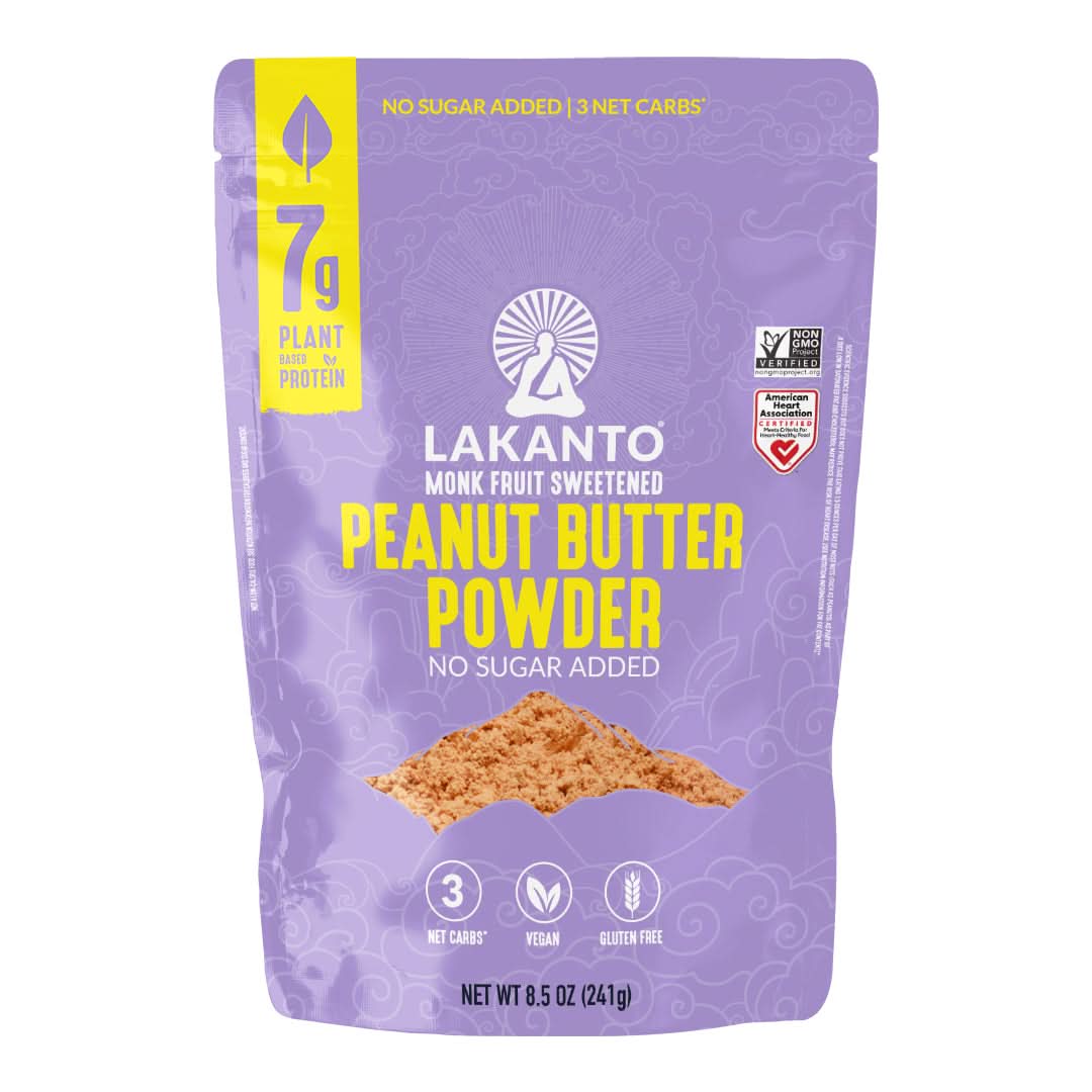 A purple bag of Lakanto Monk Fruit Sweetened Peanut Butter Powder displays nutritional information, including "7g plant-based protein" and "no sugar added," with vegan and gluten-free labels.