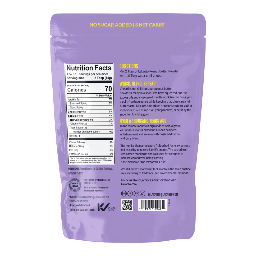 The back of a purple packaging for Lakanto Peanut Butter Powder displays nutrition facts, directions for use, and a brief history of monk fruit, emphasizing no added sugar and low carbs.
