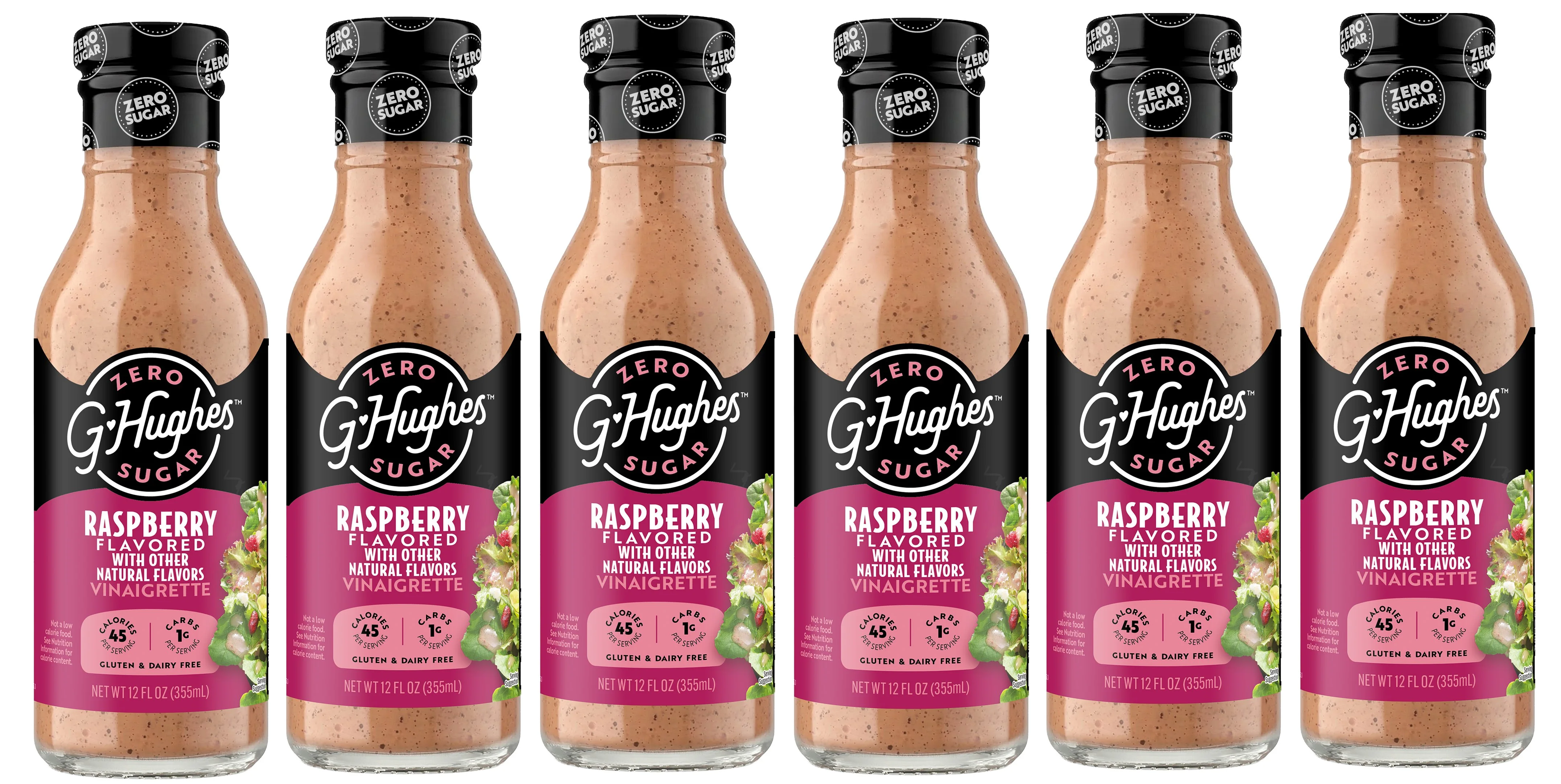 Six bottles of G. Hughes Raspberry Flavored Vinaigrette are lined up, each labeled with "Zero Sugar," highlighting its gluten-free and dairy-free attributes along with nutritional information.