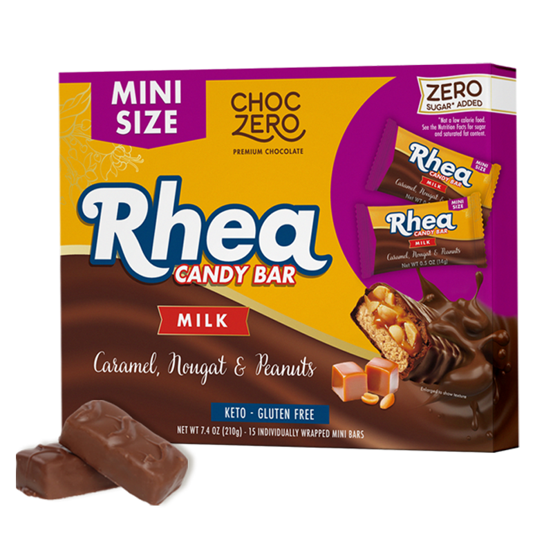 A colorful box of Rhea Candy Bars features the title prominently, with images of the mini bars showing caramel, nougat, and peanuts, labeled as keto and gluten-free, with a total of 15 individually wrapped bars.
