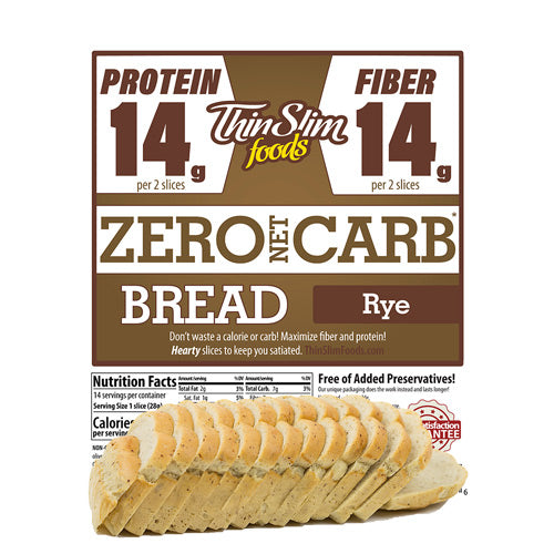 Rye bread slices are arranged neatly in front of a packaging label that highlights 14 grams of protein and fiber per two slices, emphasizing its zero net carb content.