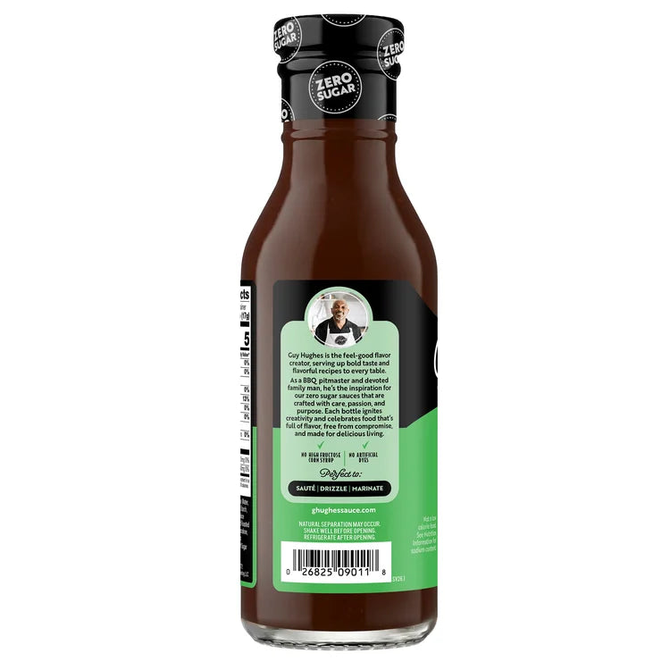 A brown sauce bottle with a black and green label features a description of the product, highlighting its zero sugar content and versatility for sautéing, drizzling, or marinating.