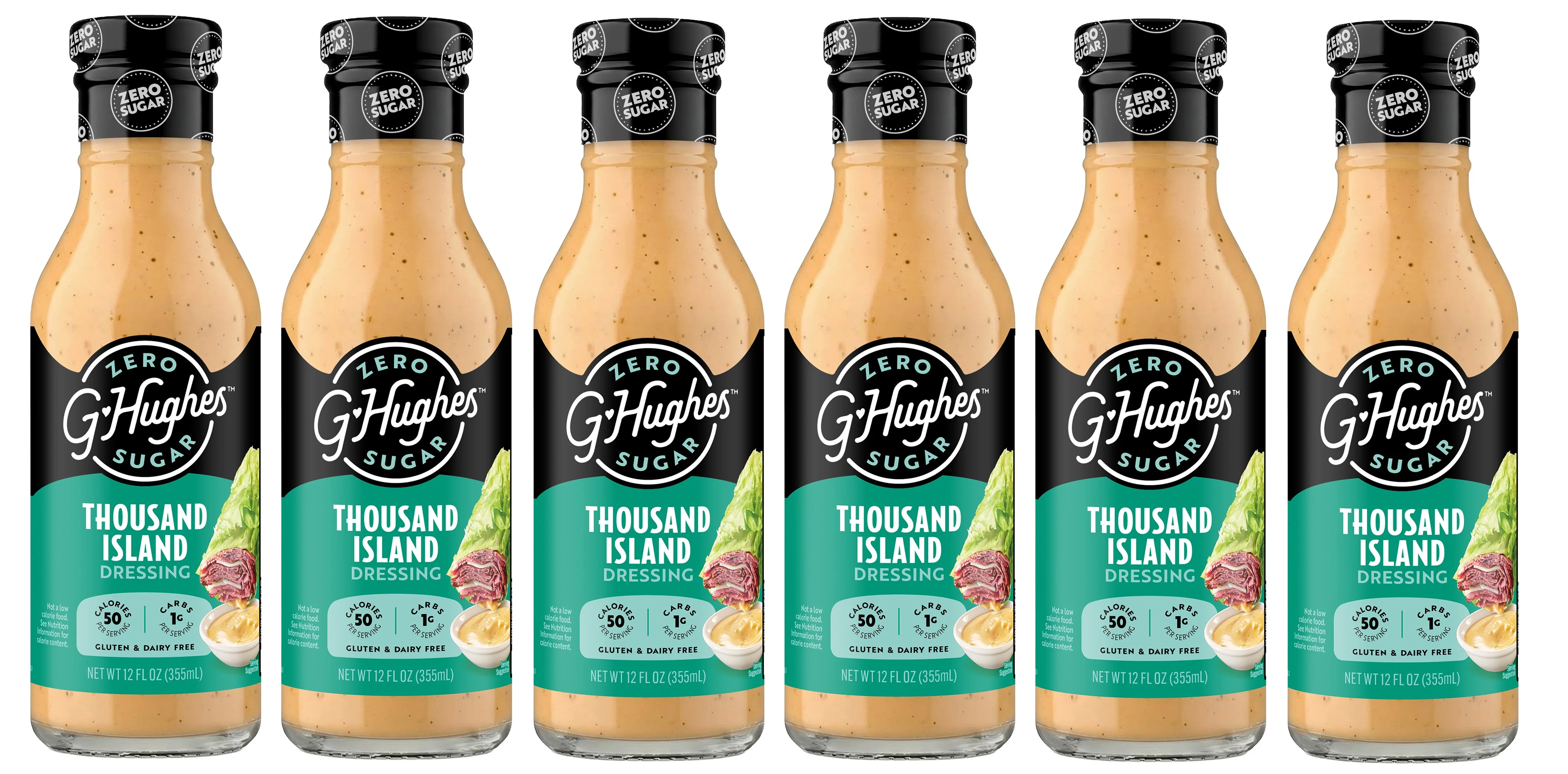 Six bottles of G. Hughes Zero Sugar Thousand Island Dressing are lined up, showcasing their clear glass design, black caps, and colorful labels featuring lettuce and meat illustrations.