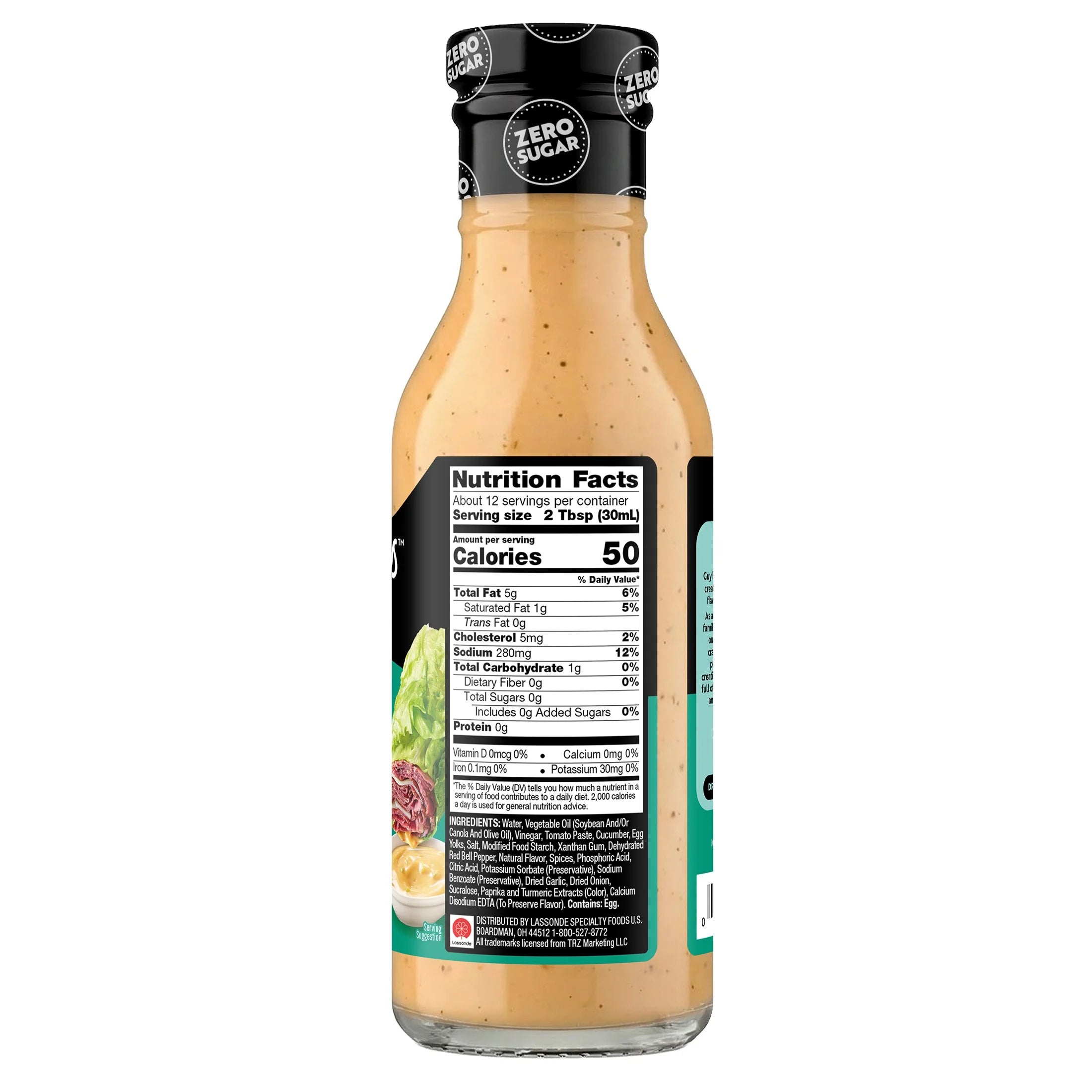A clear bottle of salad dressing with a beige color displays nutrition facts on its label, highlighting zero sugar and 50 calories per serving, set against a plain background.