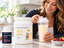 Woman preparing a vanilla protein shake in a bright kitchen with BariatricPal Protein ONE Complete Meal Replacement in Creamy French Vanilla and BariatricPal Multivitamin ONE Iron Free displayed on the countertop.