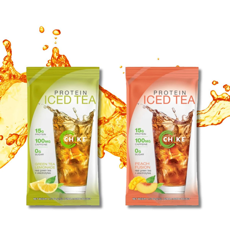 Two colorful packets of Chike Nutrition's protein iced tea, one labeled "Green Tea Lemonade" and the other "Peach Fusion," are displayed against a splash of iced tea, highlighting their refreshing flavors.