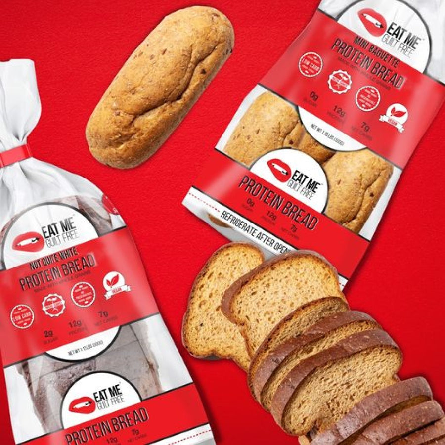 A loaf of "Not Quite White Protein Bread" and a package featuring sliced bread are displayed against a red background, highlighting their low-carb and high-protein content.
