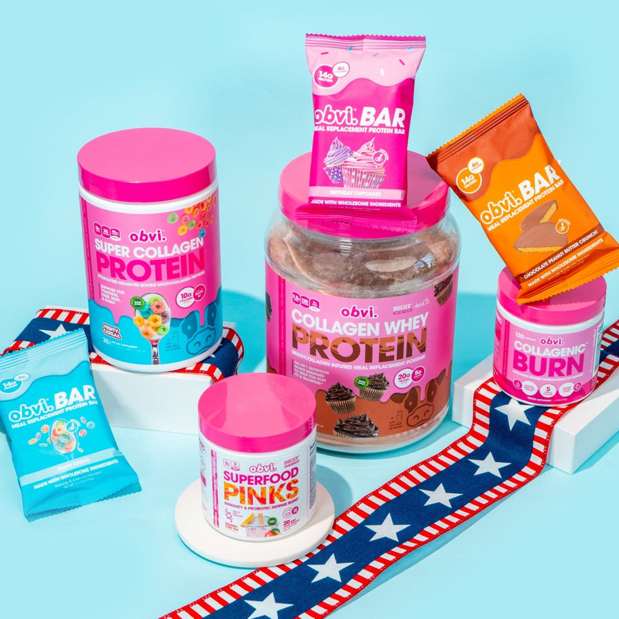 Colorful containers of OBVI collagen protein and meal replacement bars are arranged on a light blue background, with a decorative ribbon featuring red, white, and blue stripes beneath them.