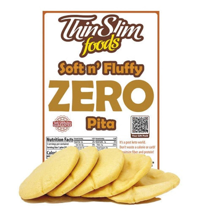 A package of ThinSlim Foods Soft n' Fluffy ZERO Pita sits behind several round, soft pita breads, showcasing the product's branding and nutritional information prominently on the front.