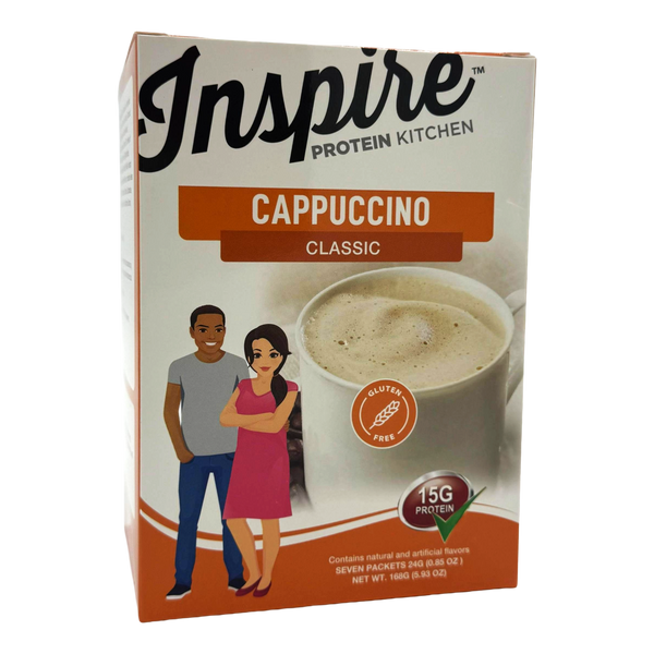 A box of Inspire Protein Kitchen Classic Cappuccino featuring a cup of cappuccino and illustrations of a man and a woman smiling, highlighting that the product is gluten-free and contains 15g of protein.