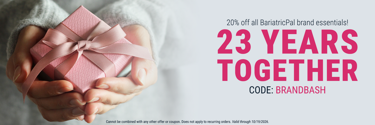 A person holds a small pink gift box with a ribbon, promoting a 20% discount on BariatricPal brand essentials to celebrate 23 years together, with a code for the offer displayed.