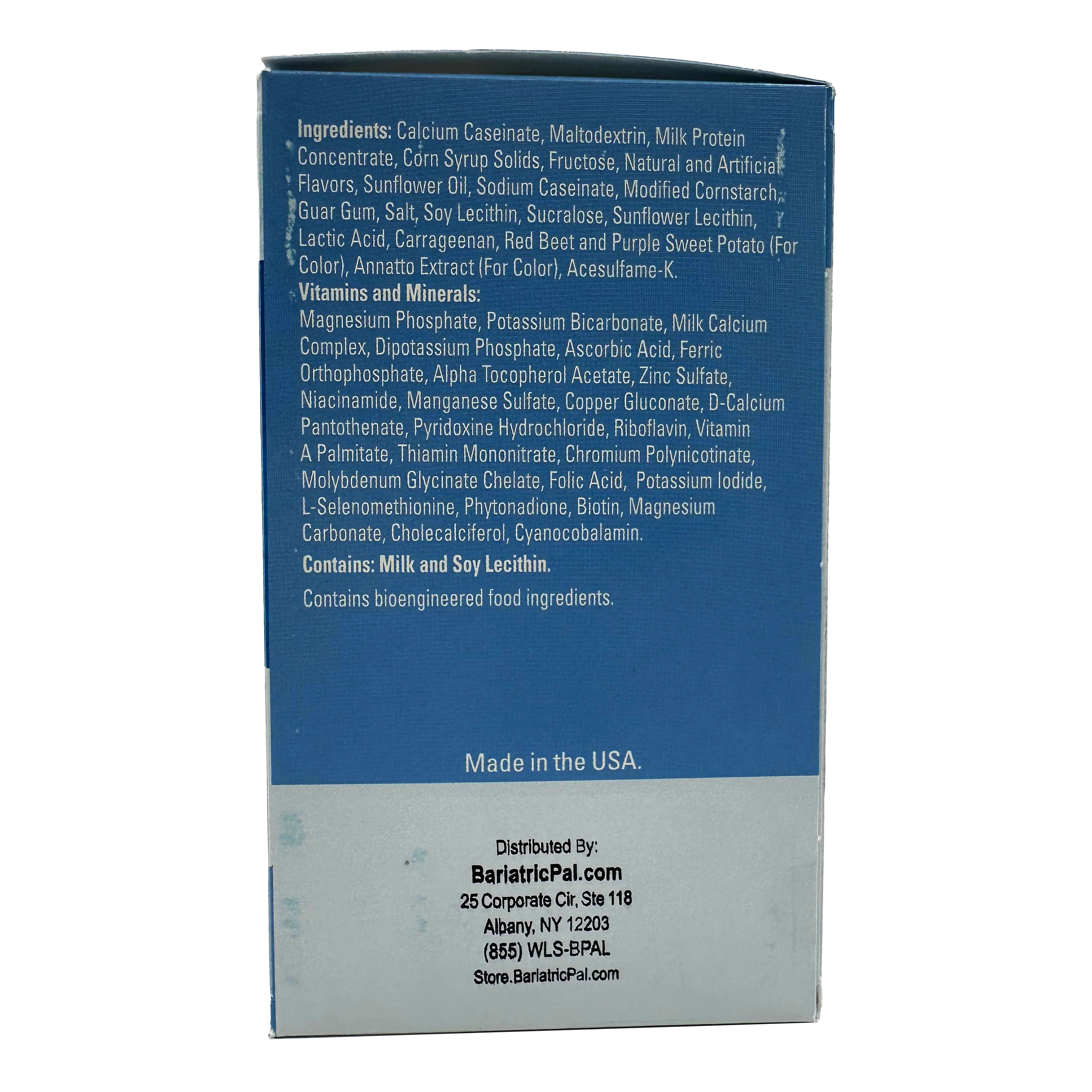 The image shows the back of a product box listing ingredients and nutritional information, featuring a blue background with text detailing various components, vitamins, and minerals.
