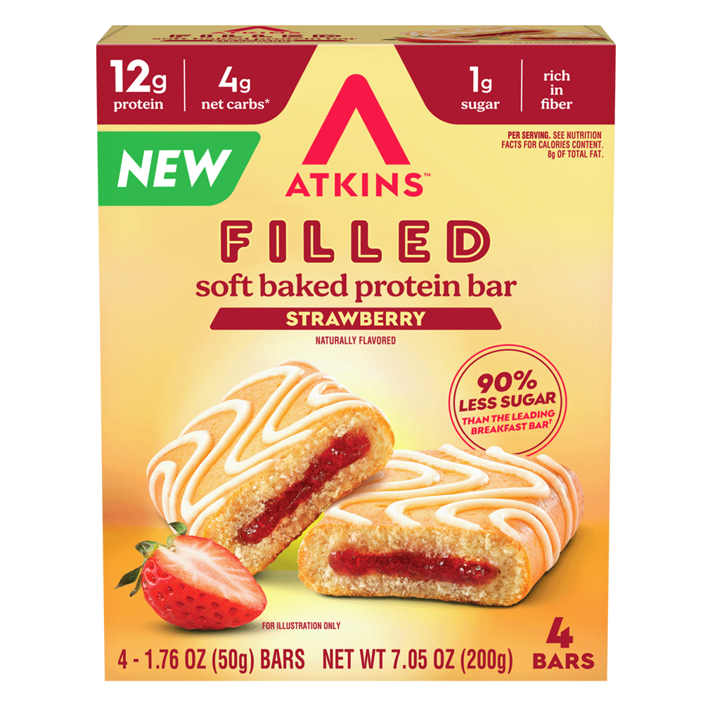 A box of Atkins Filled Soft Baked Protein Bars in Strawberry flavor, featuring two bars with a creamy white icing design and a visible strawberry filling, alongside a fresh strawberry, highlighting nutritional benefits.