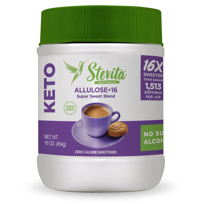 A container of Stevita Naturals Allulose sweetener features a purple lid, displays a cup of coffee with a cookie, and highlights its keto-friendly, non-GMO, zero-calorie formula with 1,513 servings per jar.