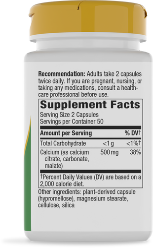 A white supplement bottle with a yellow cap displays nutritional information, including serving size, calcium content, and recommendations for use, set against a plain background.