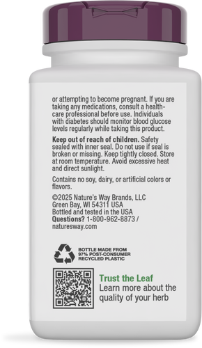 A white plastic bottle with a purple cap displays product warnings, usage instructions, and a QR code, indicating it's an herbal supplement made from recycled materials.