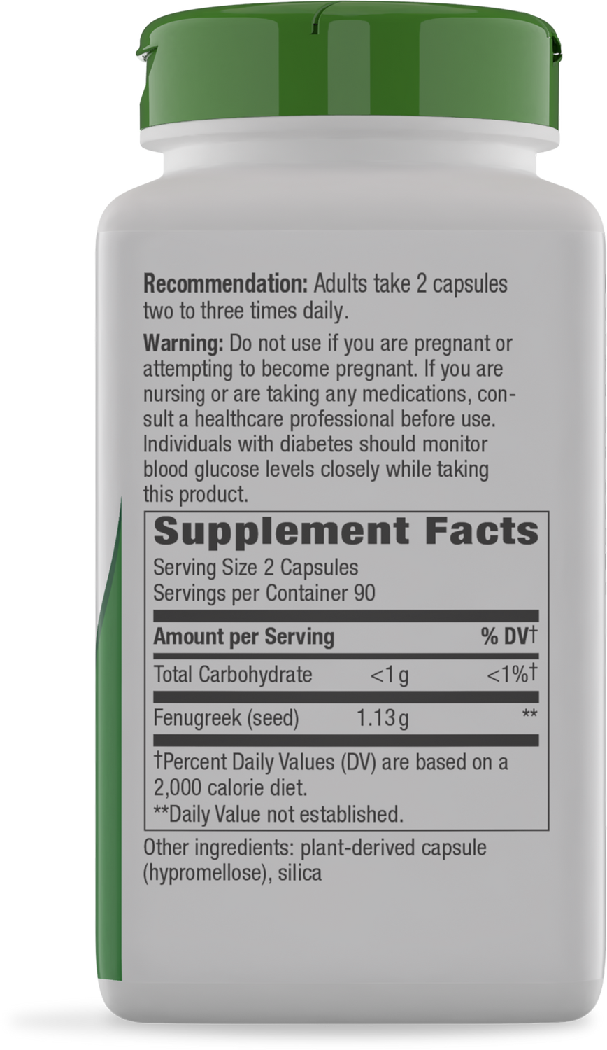 A white supplement bottle with a green cap displays a label detailing dosage recommendations, warnings, and nutritional information, including fenugreek content and serving size.