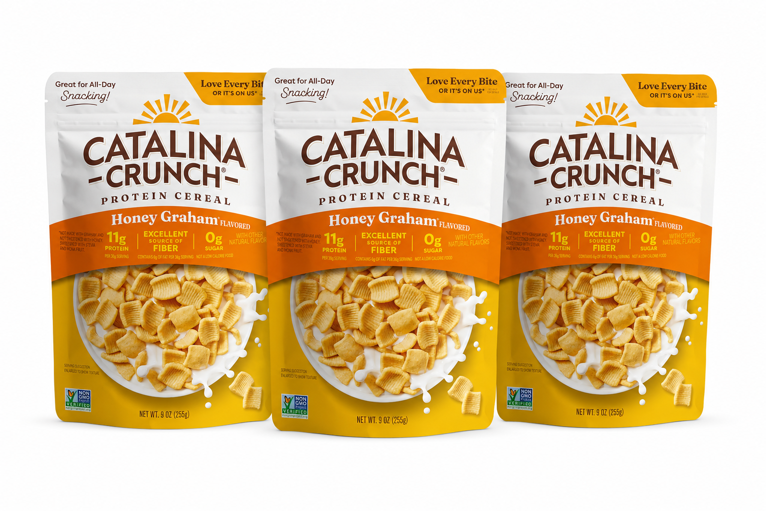 Three packages of Catalina Crunch Honey Graham protein cereal are displayed, showcasing a bright yellow design with nutritional highlights, including 11g of protein, excellent fiber, and 0g of sugar.