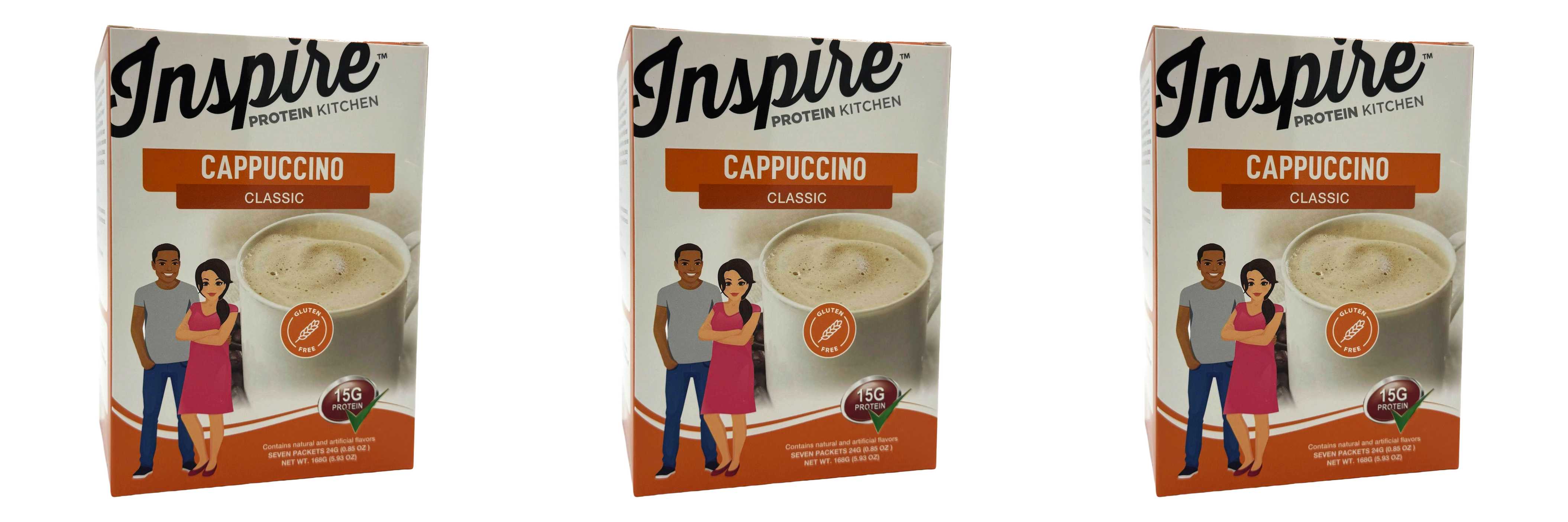 Three boxes of Inspire Protein Kitchen Cappuccino Classic, featuring a creamy cappuccino image and illustrations of a man and woman, highlight that the product is gluten-free and contains 15 grams of protein.
